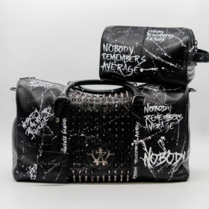 Black studded bags with graffiti print.