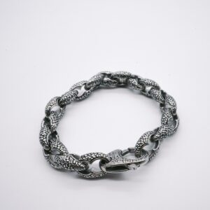 Circular bracelet made of intertwined, textured snake-like silver links, displayed on a plain white background. Product Name: Metal Link Bracelet.
