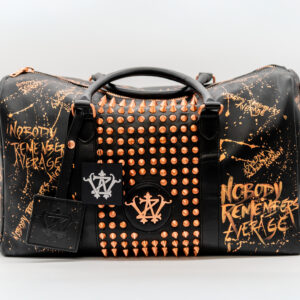 Black studded leather bag, rose gold graffiti.